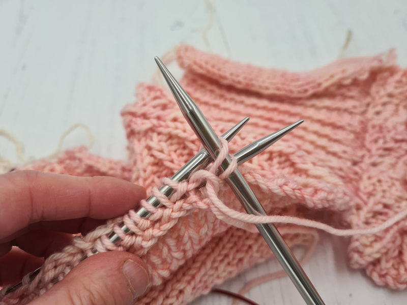 knitting stitches together to attach a shawl collar to neckline